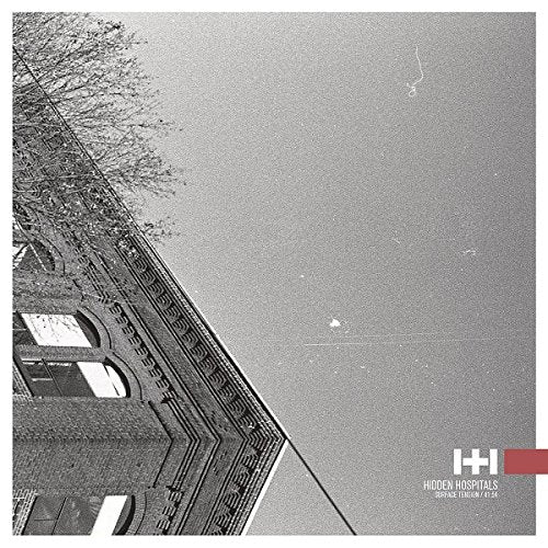Black and white album cover featuring a building and cloudy sky.