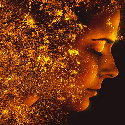 CD cover: woman’s face dissolving into golden particles, side profile.