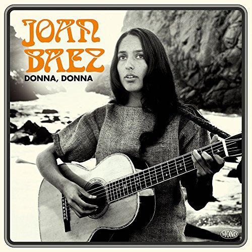 Joan Baez playing acoustic guitar on album cover, beach background.