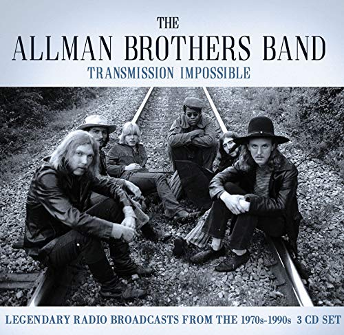 Allman Brothers Band album cover: band members seated on railroad tracks.