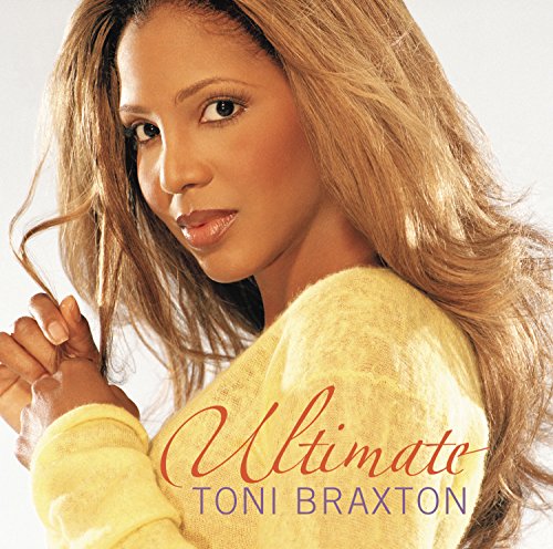 Toni Braxton album cover, close-up portrait with long wavy hair.