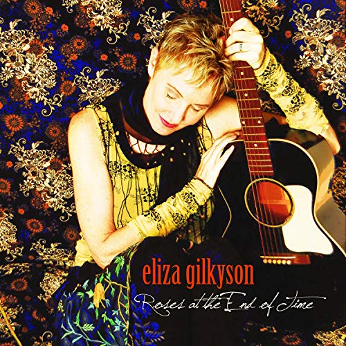 Eliza Gilkyson album cover with artist holding an acoustic guitar.