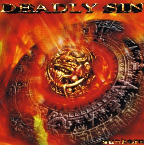 CD cover: fiery orange and red design with a Mayan-style face.