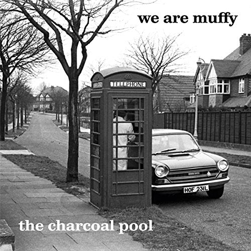 Black and white CD cover with a British phone booth and car.