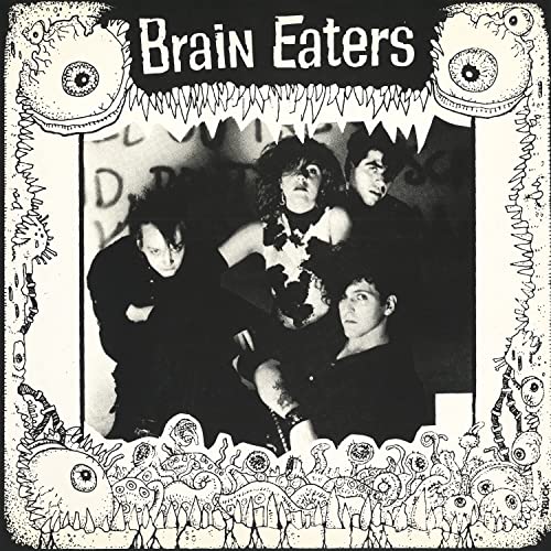 Black and white album cover featuring four people and cartoon eyes.
