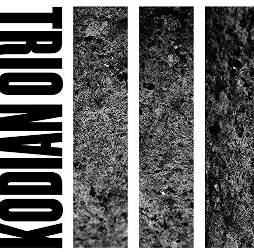 CD cover with black and white abstract textured vertical stripes.