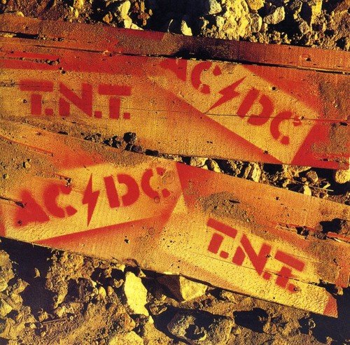 AC/DC "TNT" album cover with red lettering on weathered wood.