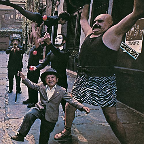 Album cover for The Doors’ “Strange Days” featuring performers in a street.
