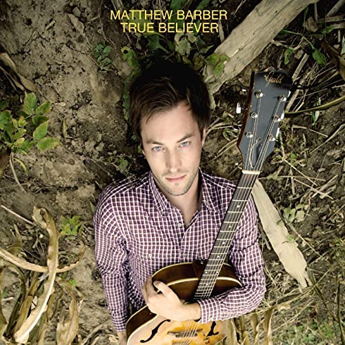 Matthew Barber album cover: artist with guitar lying in grass.