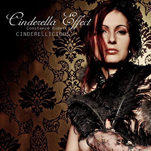 CD cover featuring a woman with red hair and dark, ornate background.