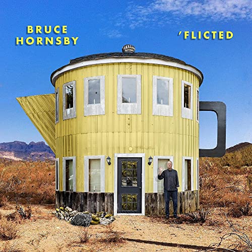 Bruce Hornsby album cover: a yellow teapot-shaped building in a desert.