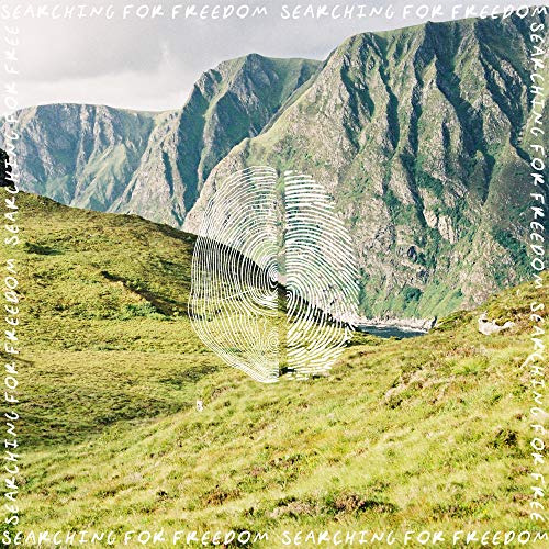 CD cover with mountains, green field, and a circular graphic.