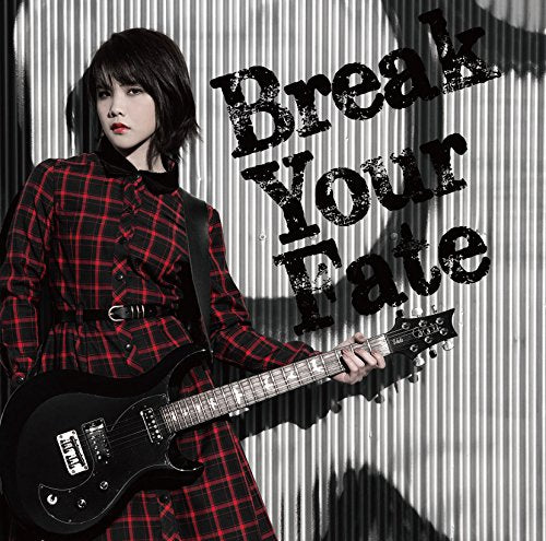 Woman with a black electric guitar, red plaid outfit, and text overlay.