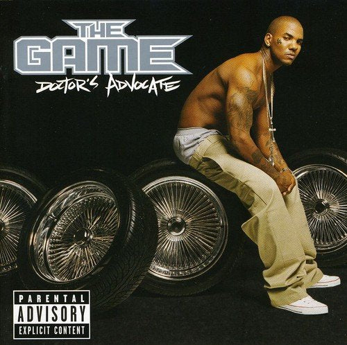 Album cover for The Game’s “Doctor’s Advocate” featuring a rapper and car wheels.