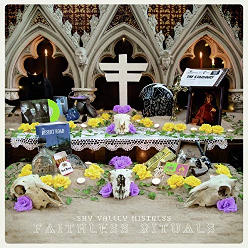 Album cover for Sky Valley Mistress, featuring a ritualistic scene with skulls and candles.