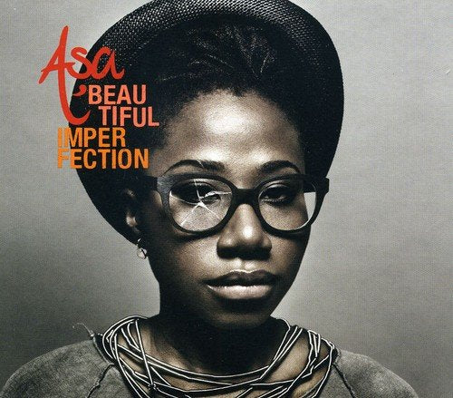 Asa album cover: woman with glasses and afro, muted tones.
