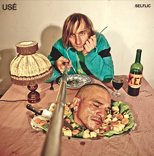 CD cover: man with a head-shaped salad, another man eating.