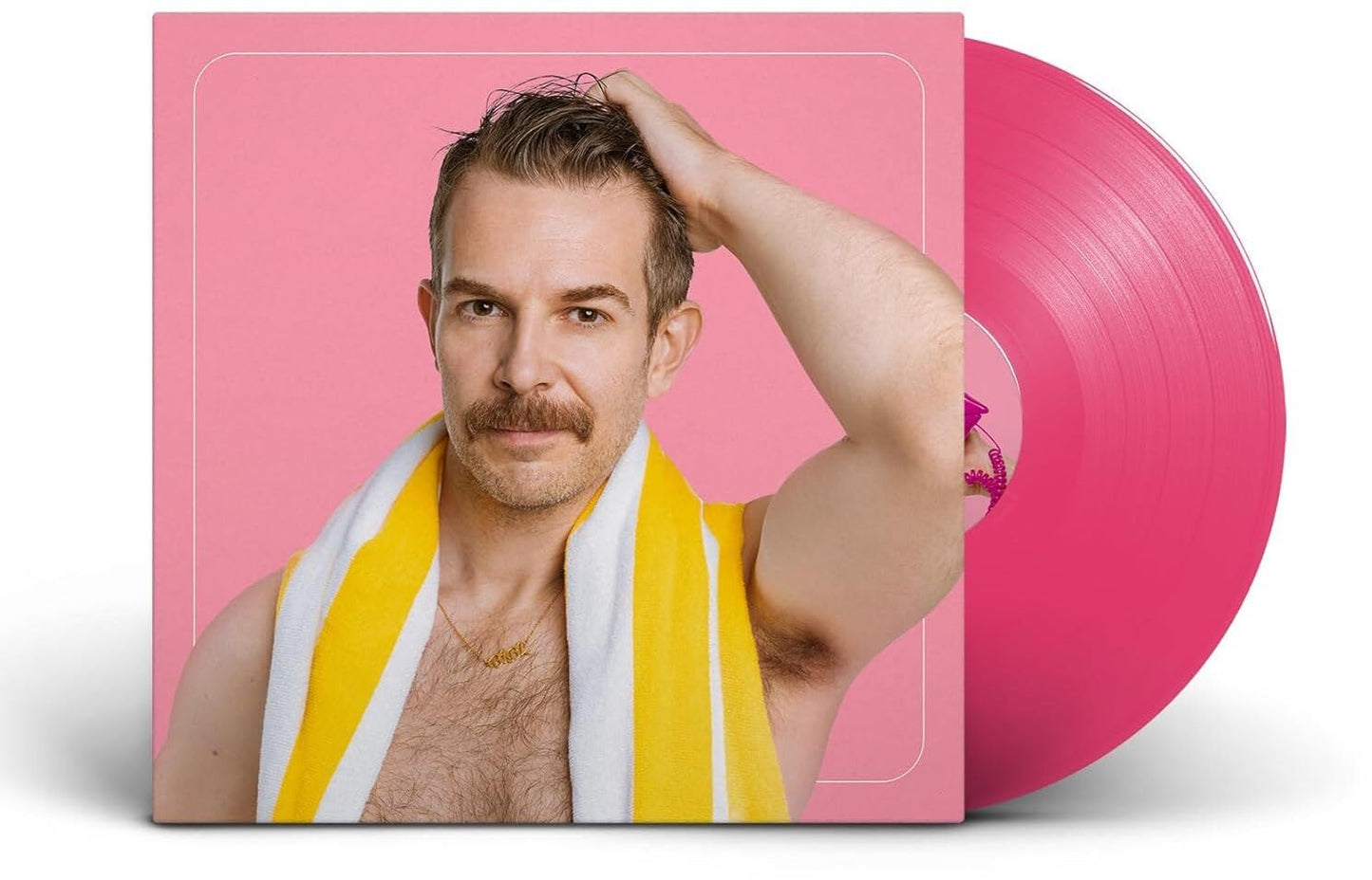 Pink vinyl record with album cover featuring a man with a mustache.