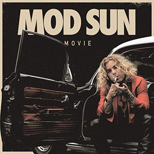 Mod Sun album cover: artist with car, red jacket, and cigarette.