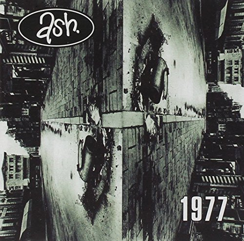 Album cover for Ash - 1977, featuring distorted urban imagery.