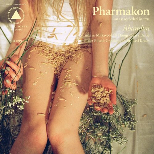 CD cover: person’s torso and legs covered in grains and flowers.