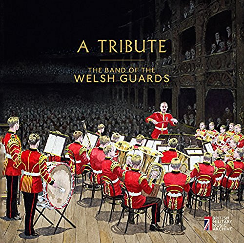 Welsh Guards band in red uniforms performing on a stage with an audience.