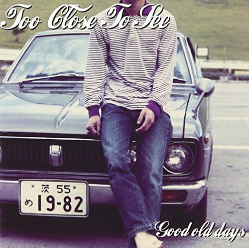 CD cover: man leaning on a vintage car, sepia toned.