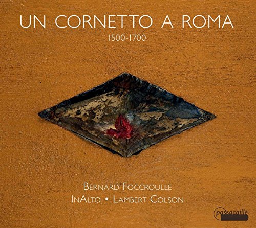 CD cover: orange background, dark diamond shape with floral detail.