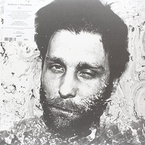 Black and white vinyl record cover featuring a portrait of a man.