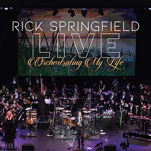 Rick Springfield live album cover with orchestra and stage performance.