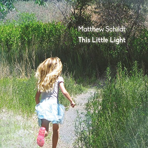 CD cover: girl running on a path with green foliage.