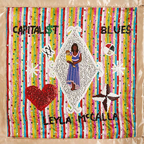 CD cover: colorful, embroidered artwork featuring a woman with a child.