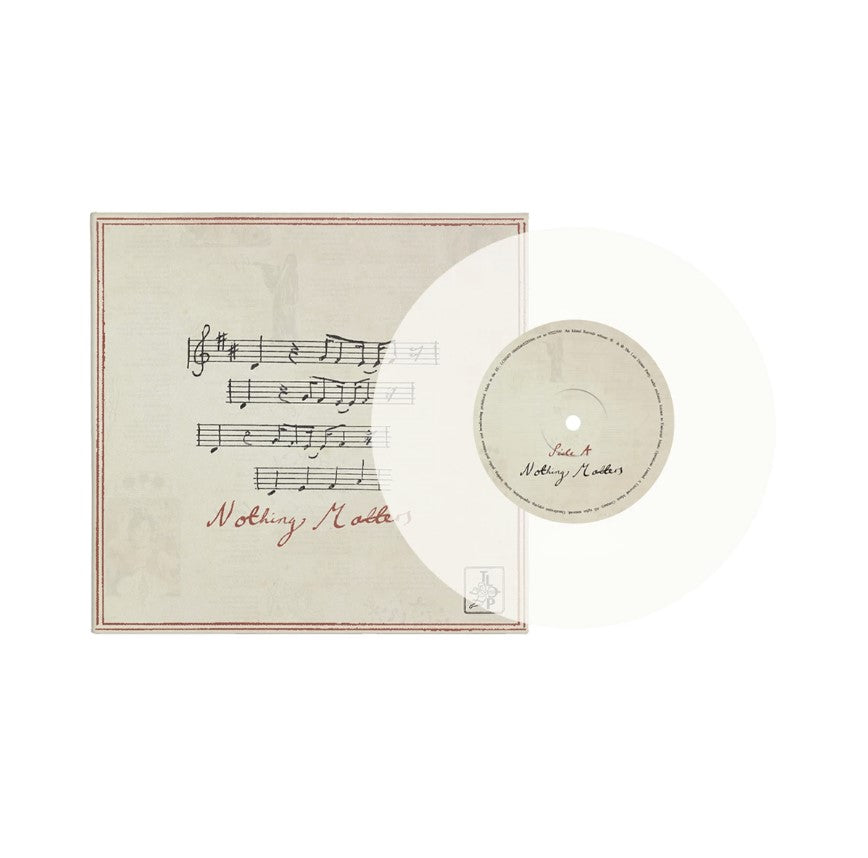 Vinyl record jacket with ornate design and black record visible.
