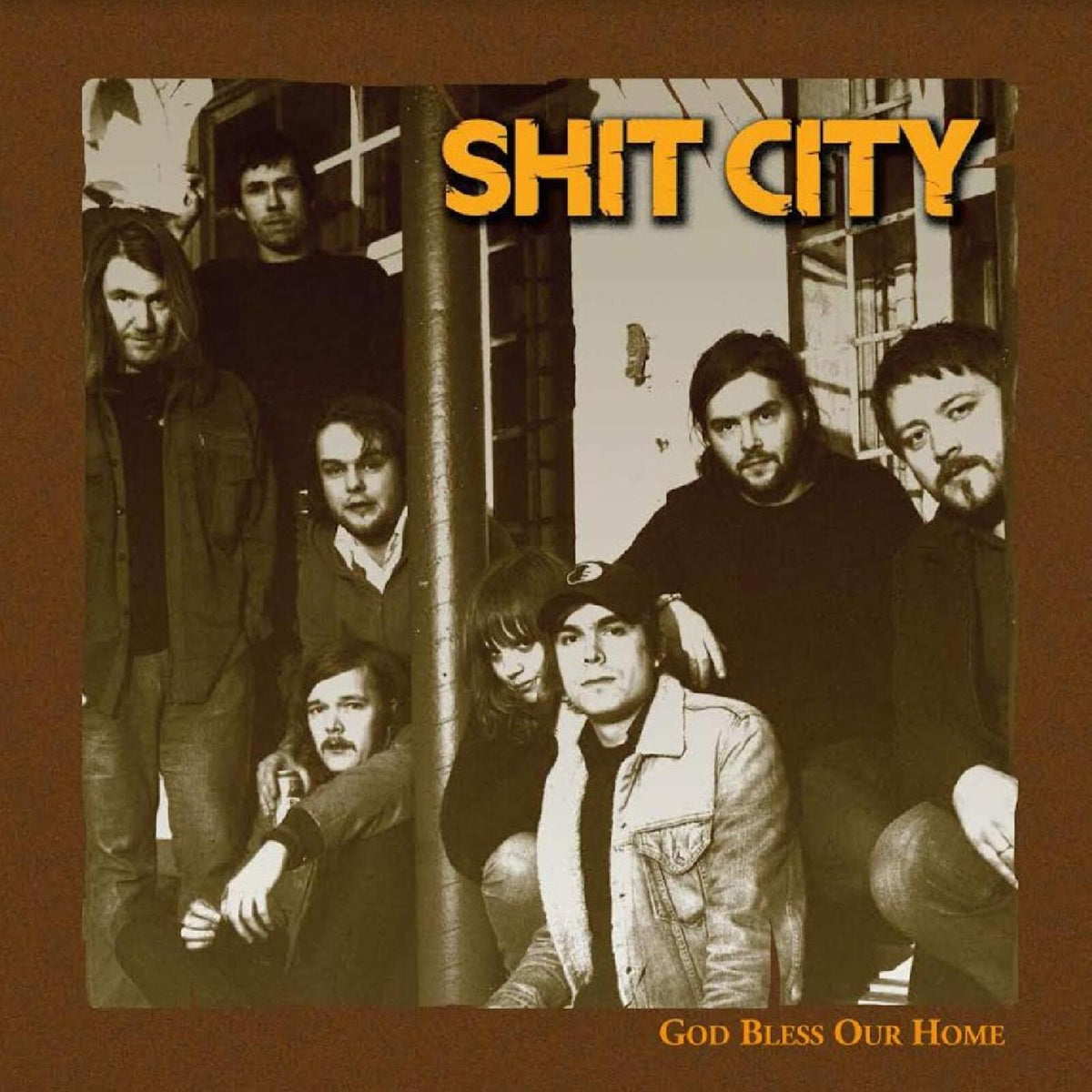 Sepia-toned album cover featuring a band and the text "Shit City.
