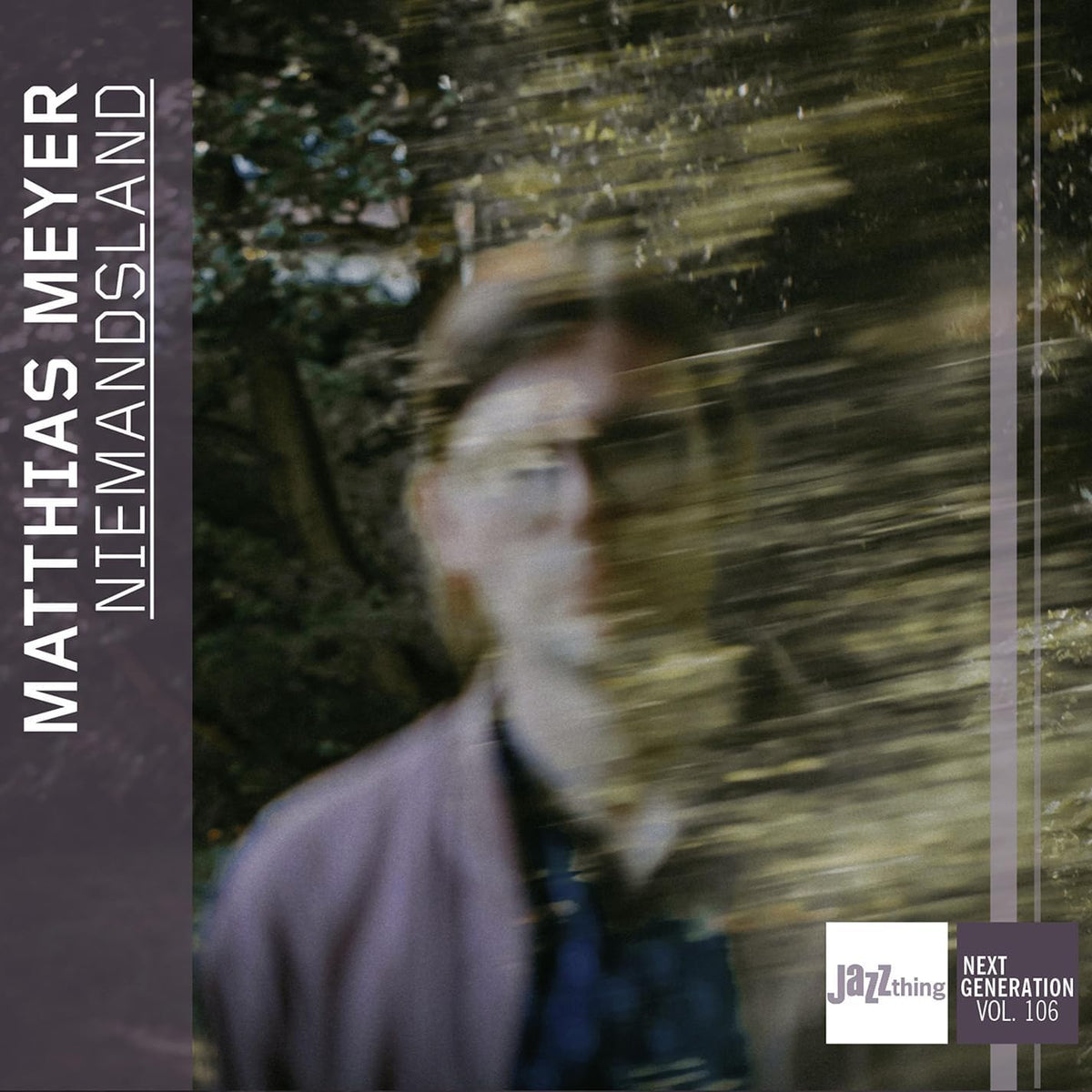 CD cover: blurry image of a man walking into a forest.