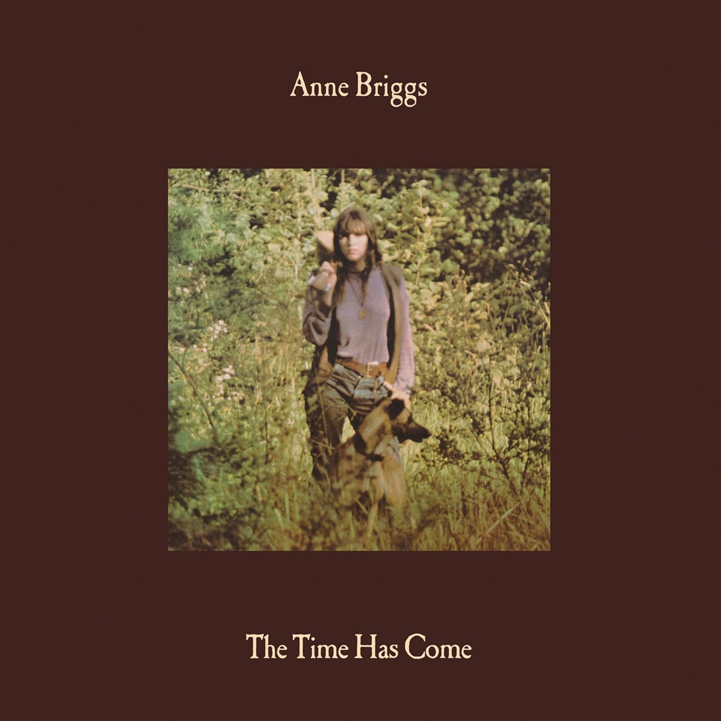 Album cover for Anne Briggs’ “The Time Has Come” featuring a woman with a dog.