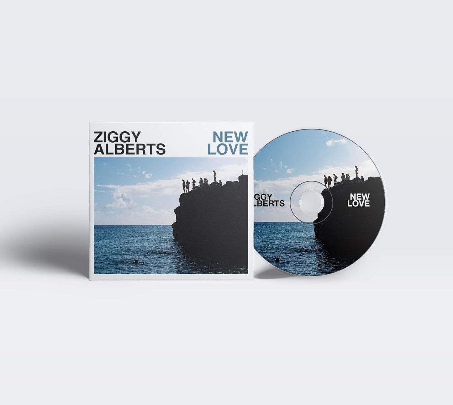 Ziggy Alberts "New Love" CD case with ocean and rock imagery.