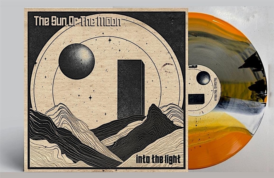 Vinyl record with a celestial and mountainous album cover design.