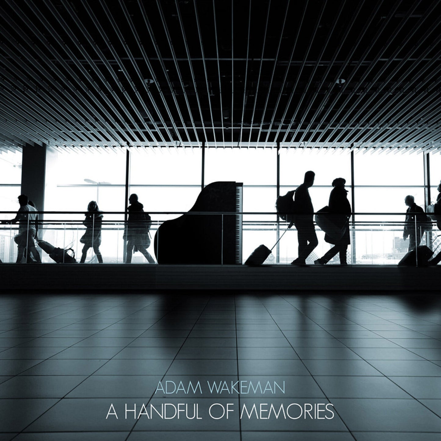 Album cover for Adam Wakeman’s “A Handful Of Memories” with airport scene.