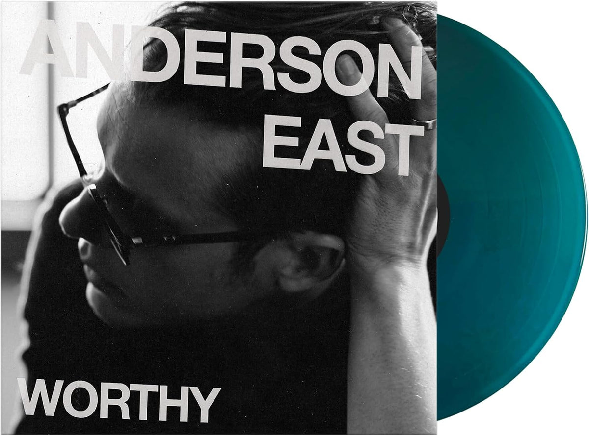 Anderson East's "Worthy" vinyl record with teal-colored disc shown.