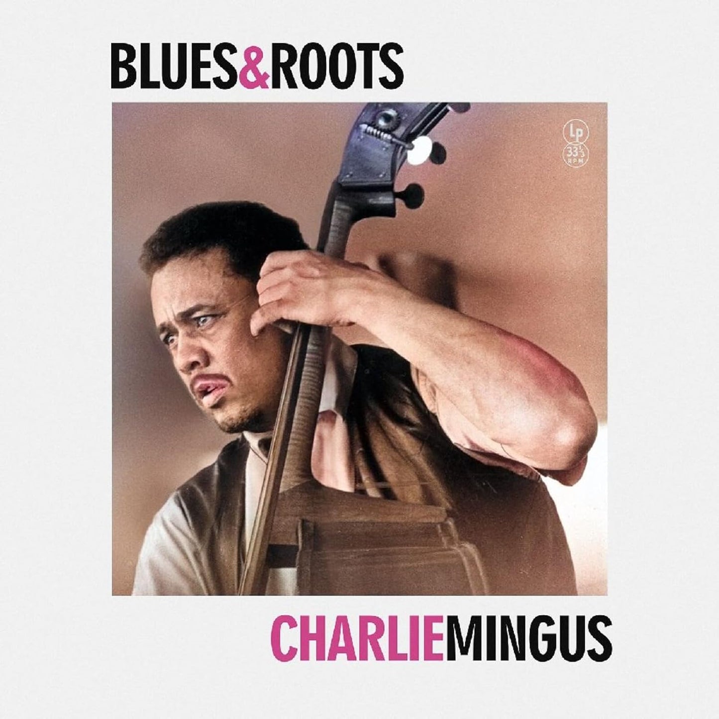 Album cover for Charles Mingus’ “Blues & Roots” featuring a bassist.