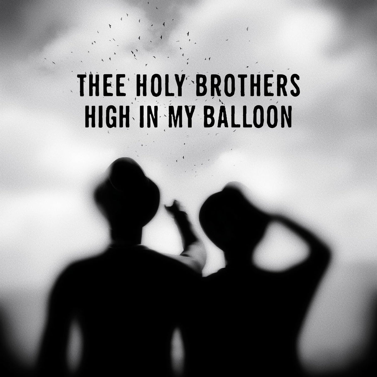 Black and white album cover featuring two silhouetted figures and text.