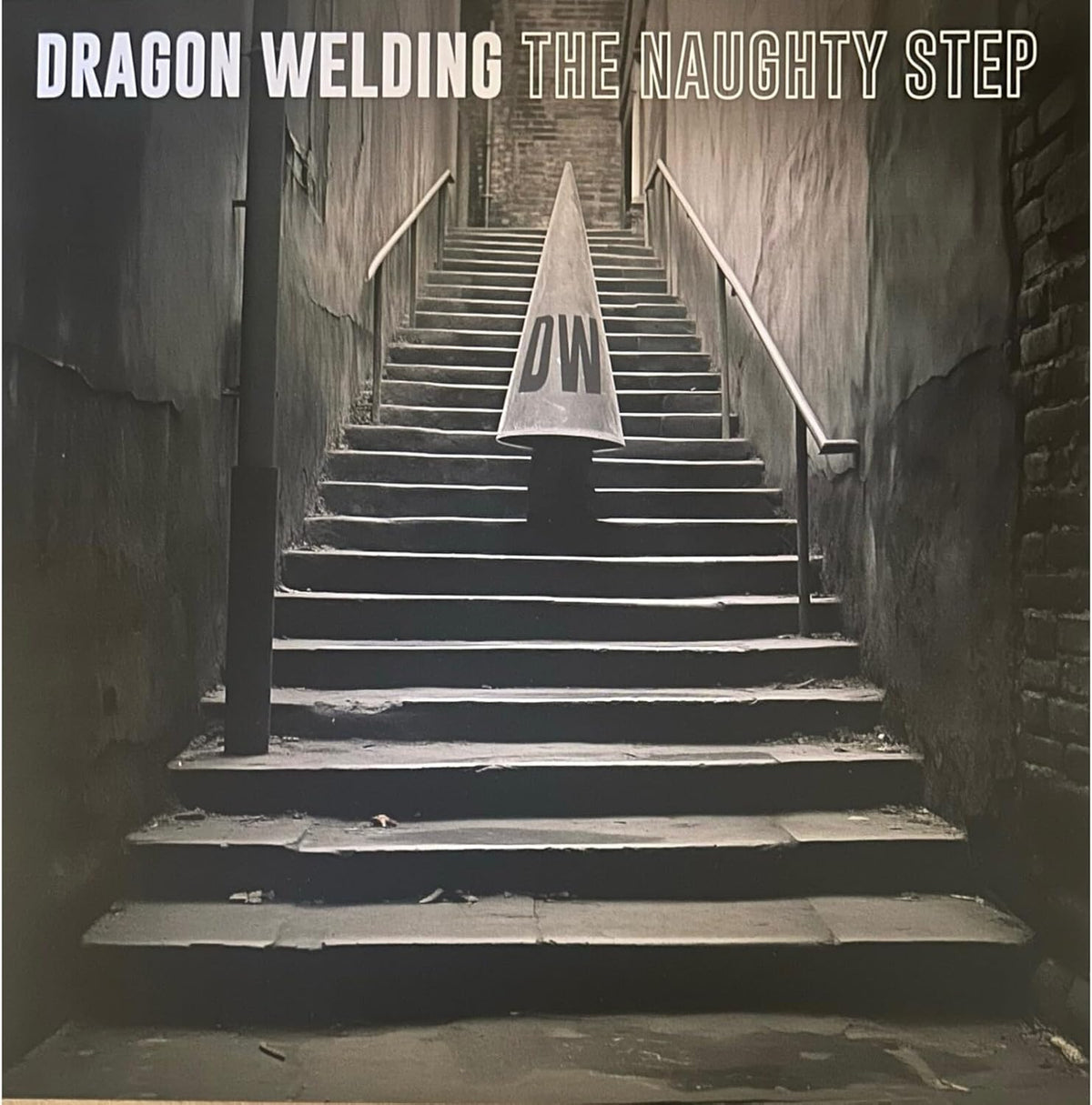 Black and white album cover featuring a staircase and a pointed object.