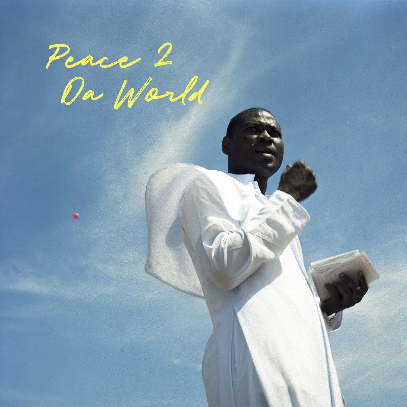 Album cover featuring a man in white against a blue sky.