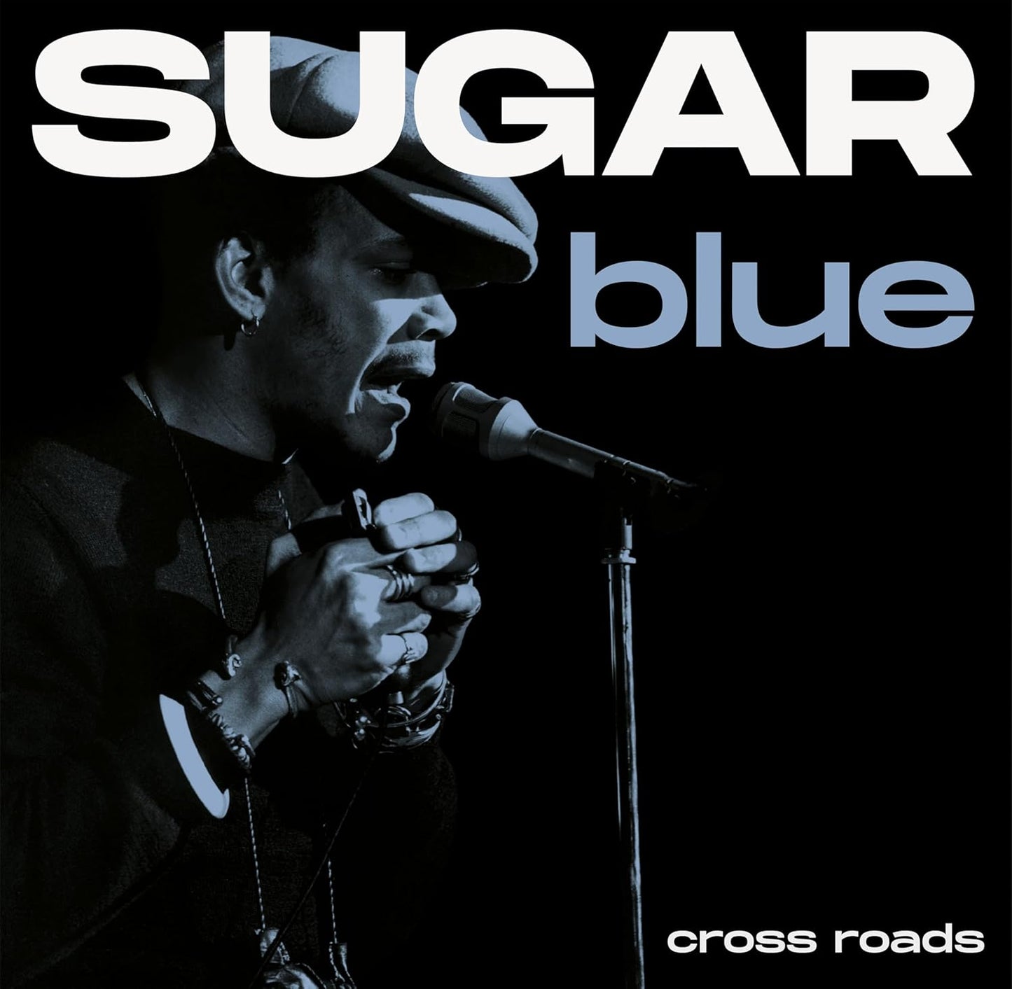 Sugar Blue album cover featuring a blues musician singing into a microphone.