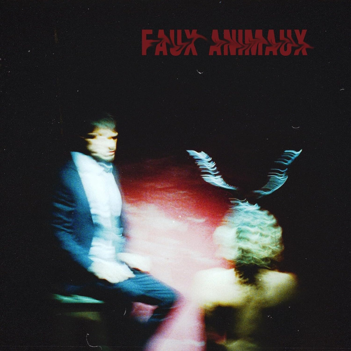 CD cover with blurred figures and red text reading "Faux Animaux".