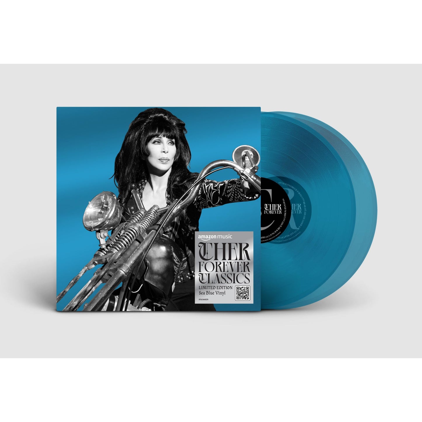 Cher on a motorcycle album cover with two translucent sea blue vinyl records.