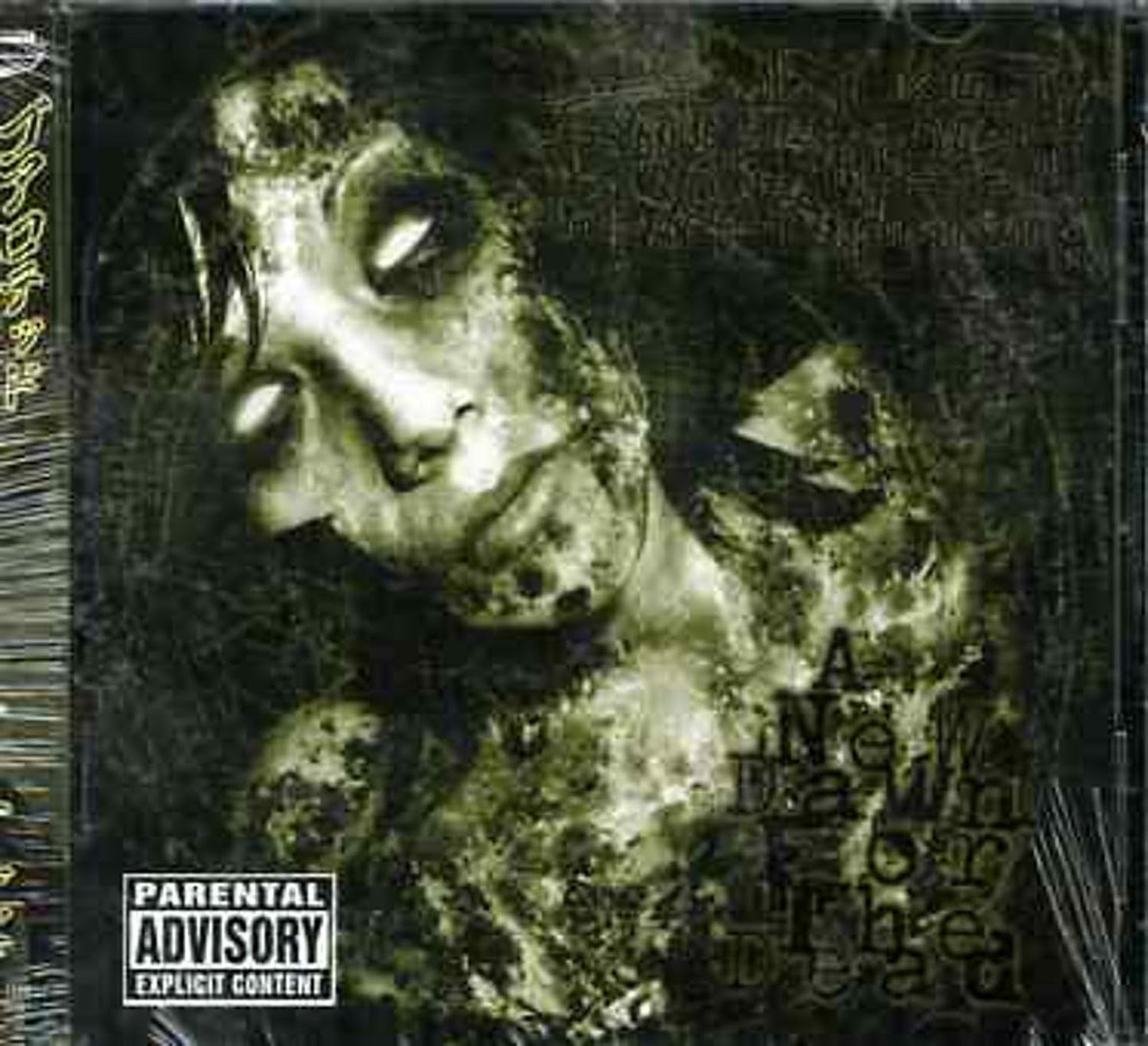 Zombie face album cover with orange tint and parental advisory label.