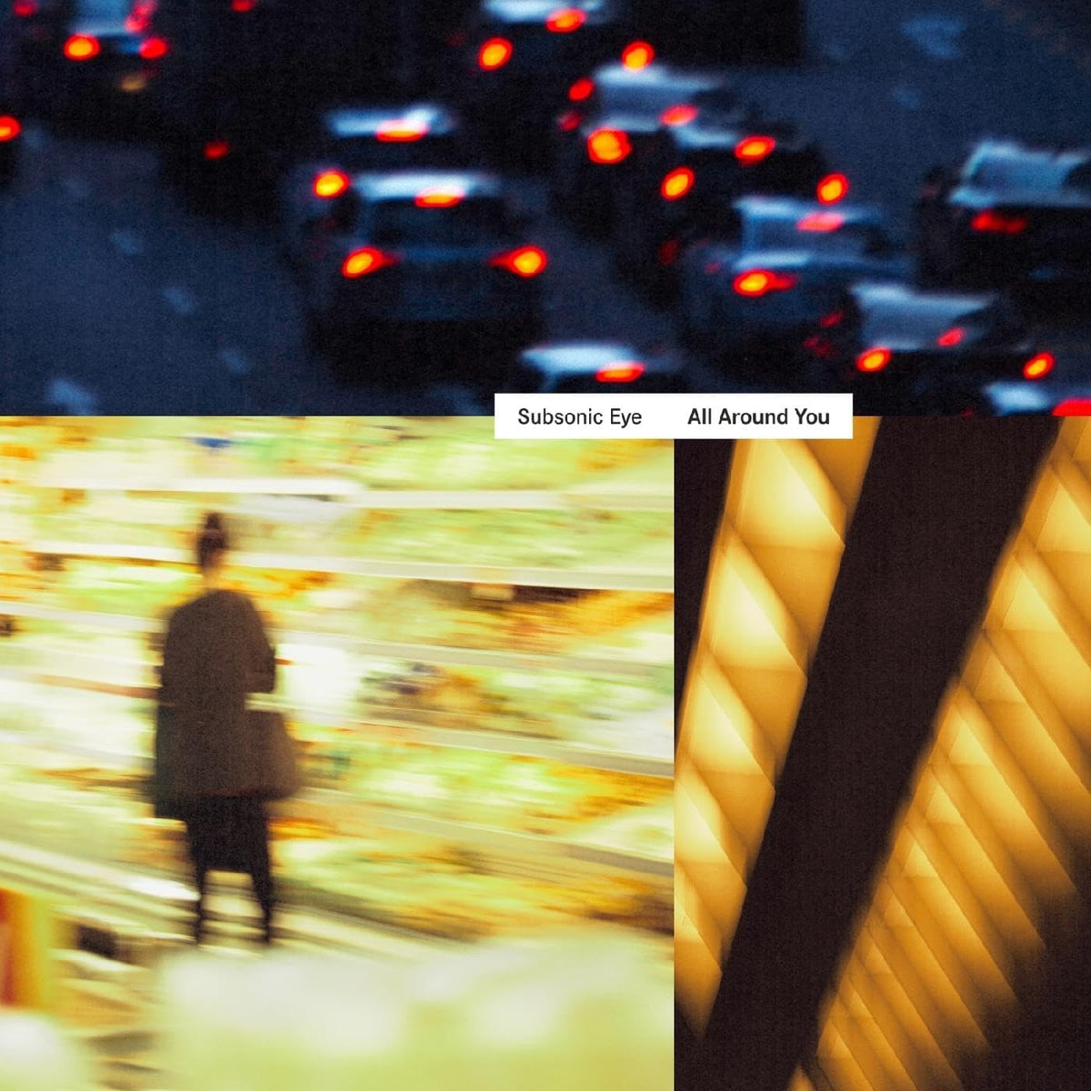 Album cover with blurred figure, traffic lights, and geometric building facade.