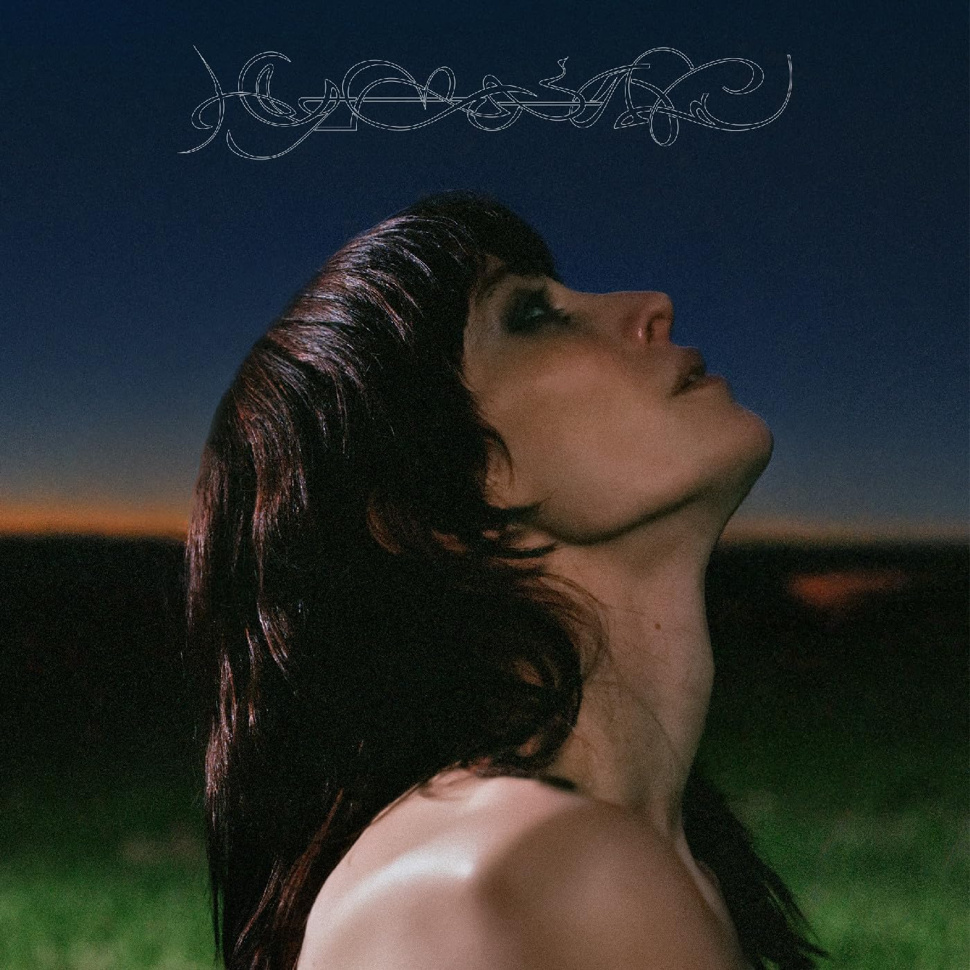 Album cover for Lyra Pramuk’s “Hymnal” featuring a woman looking upwards.